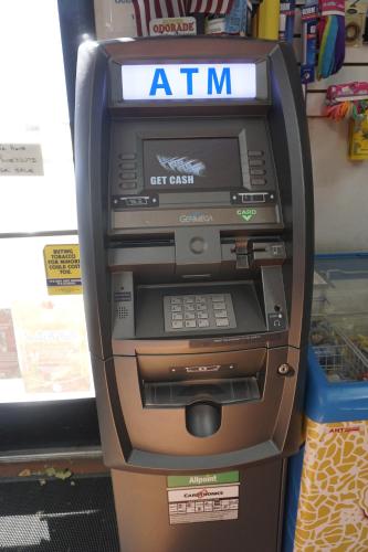 an atm machine is sitting in a store at Bristlecone Motel in Big Pine