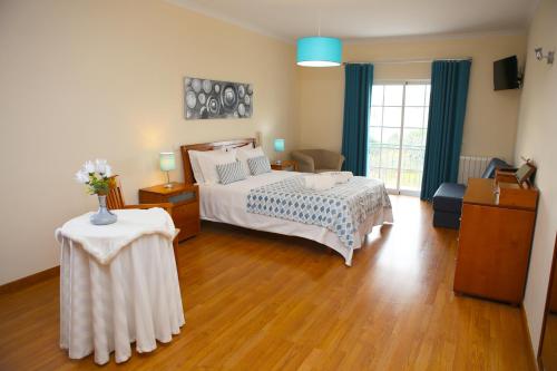 מיטה או מיטות בחדר ב-Casa Sousa