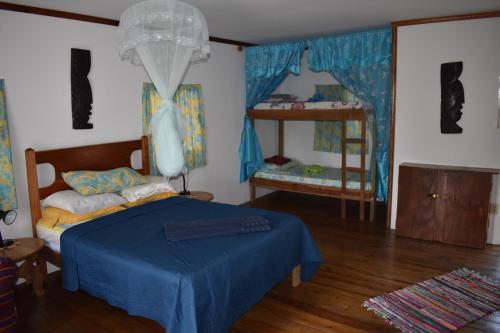 a bedroom with a bed and two bunk beds at Hidden Haven in Unitedville