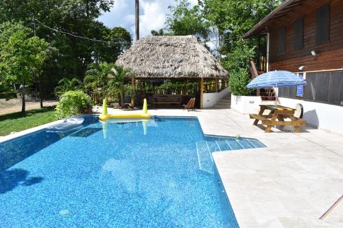 a swimming pool with a gazebo next to a house at Hidden Haven in Unitedville