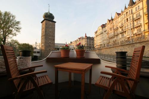 a large stone building with a clock tower on top of it at Boat Hotel Matylda in Prague