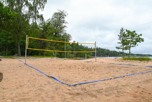 a volley ball net on a sandy beach at Ursand Resort & Camping in Vänersborg