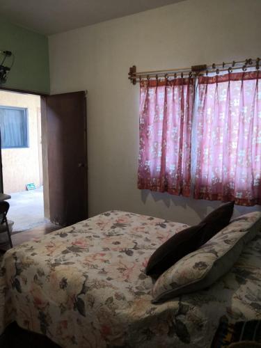 Postel nebo postele na pokoji v ubytování Pension Baja Paradise