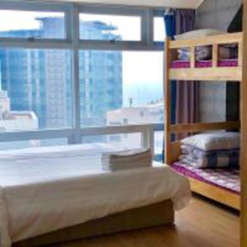 Postel nebo postele na pokoji v ubytování Busan Popcorn Hostel