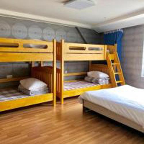 Postel nebo postele na pokoji v ubytování Busan Popcorn Hostel