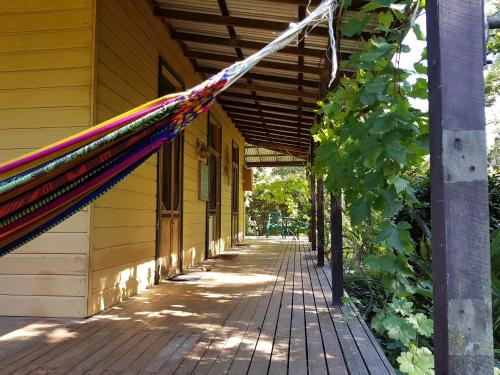 a hammock hanging off the side of a building at Freida - Historic Farmhouse Bellingen in Gleniffer