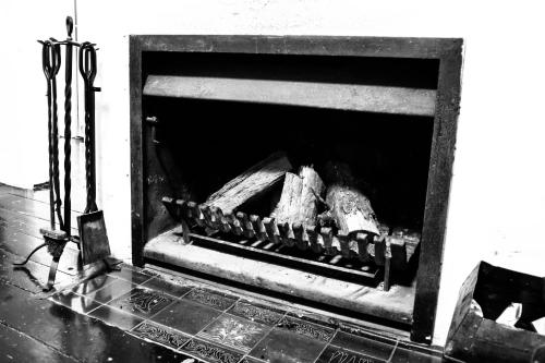 a black and white photo of a fireplace at Piccolo in Leura