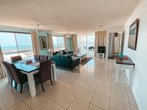 a living room with a couch and a table at Bargara Blue Resort in Bargara