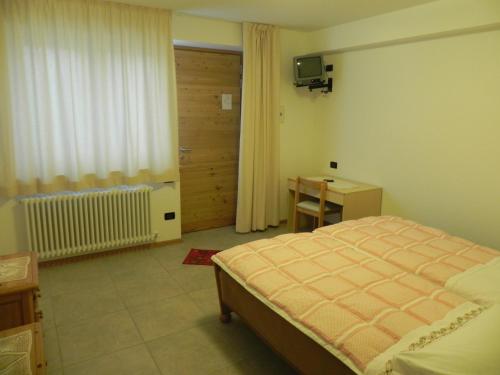 Postel nebo postele na pokoji v ubytování Rifugio Capanna Bill