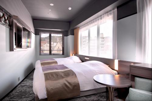 Lova arba lovos apgyvendinimo įstaigoje Kobe Plaza Hotel West