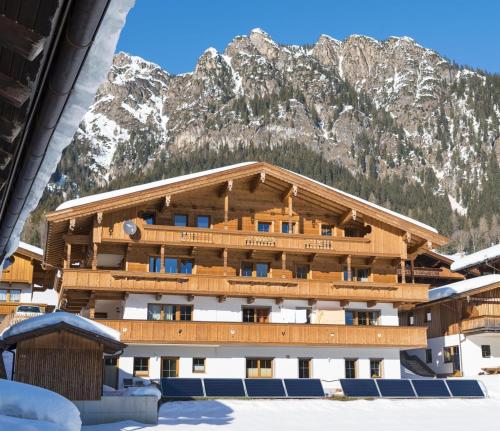 a building in front of a mountain at Haus Dorferstuck in Alpbach