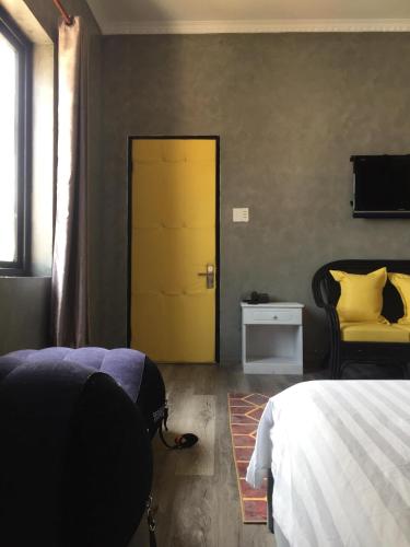 Postel nebo postele na pokoji v ubytování Dylan Hotel