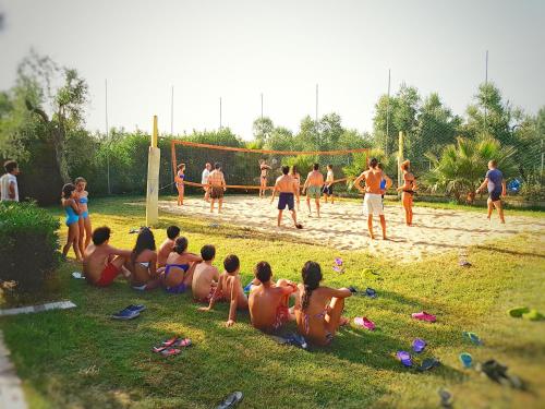 a group of people playing a game of volley ball at Villaggio Alba Chiara in Vieste