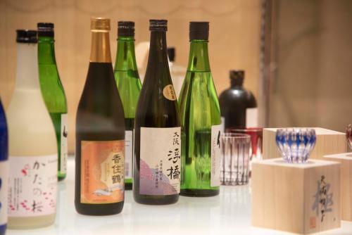 a group of bottles of wine sitting on a counter at Hotel Granvia Osaka-JR Hotel Group in Osaka