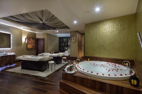 a large bathroom with two sinks and a large tub at Merit Royal Premium Hotel Casino & SPA in Kyrenia