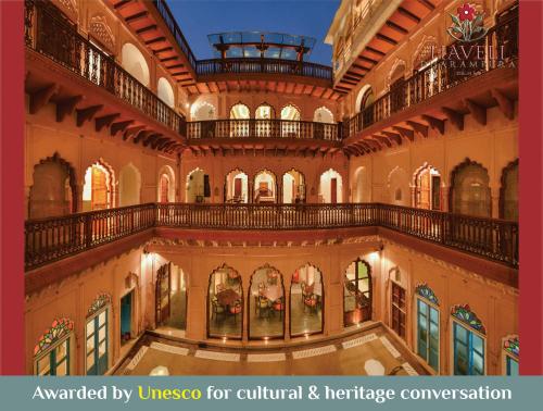 een afbeelding van een gebouw met de woorden toegekend door unico voor cultureel en erfgoed bij Haveli Dharampura - UNESCO awarded Boutique Heritage Hotel in New Delhi