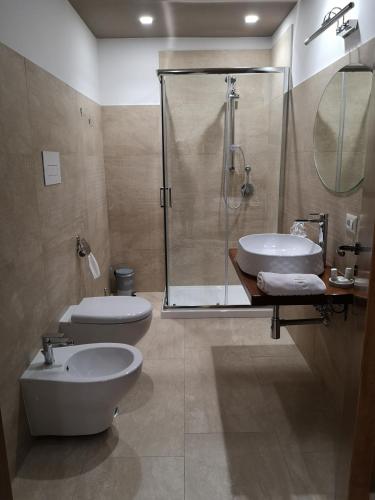 a bathroom with a shower and a toilet and a sink at Agriturismo La Fattoria B&B in Limatola