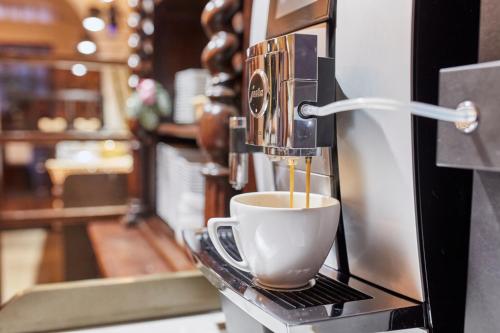 a coffee machine is making a cup of coffee at Pollera in Kraków