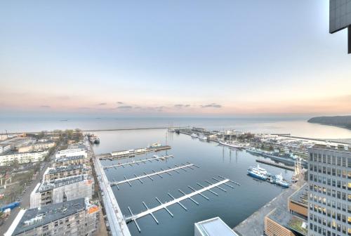 an aerial view of a harbor with boats in the water at Dom & House - Apartamenty Sea Towers in Gdynia