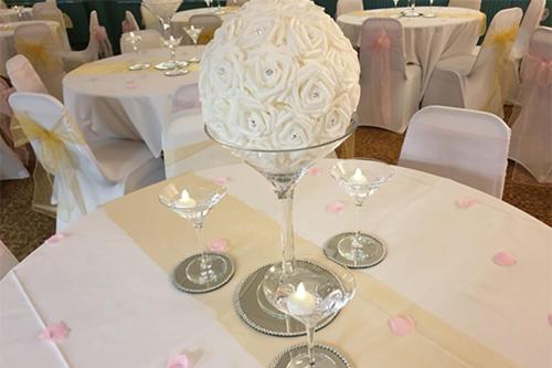 a table with two wine glasses on top of it at The Avenue Club and Lodge in Birmingham