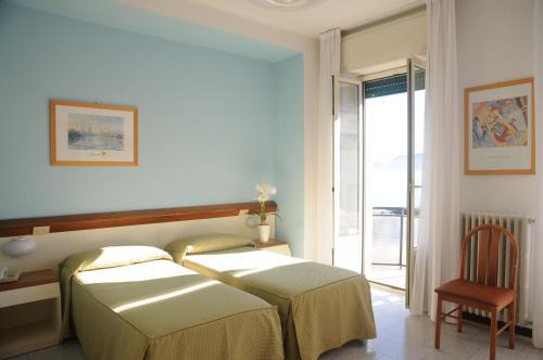 Posteľ alebo postele v izbe v ubytovaní Hotel Italie et Suisse