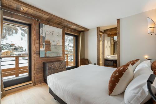 Кровать или кровати в номере Appartement Ourson - LES CHALETS COVAREL