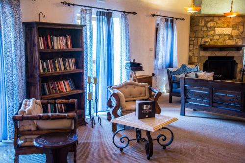 a living room filled with furniture and a fireplace at Abeliona Retreat in Ambeliona