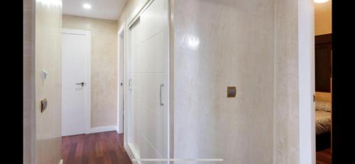 a walk in shower in a room with a door at Villa Campito in El Puerto de Santa María