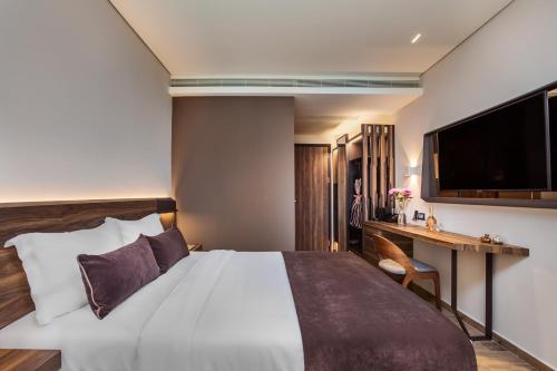 Ένα ή περισσότερα κρεβάτια σε δωμάτιο στο Imperial Plus Urban Smart Hotel Thessaloniki
