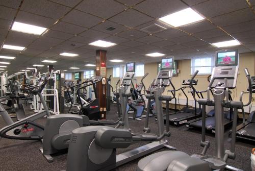 a gym with a lot of treadmills and machines at Seaview, A Dolce Hotel in Galloway