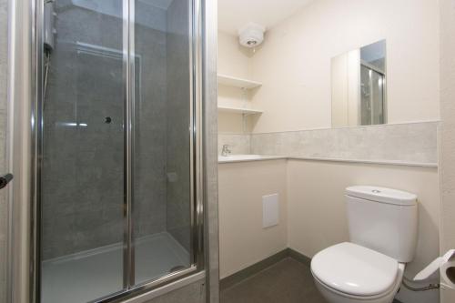 a bathroom with a toilet and a shower at Destiny Student - Meadow Court in Edinburgh