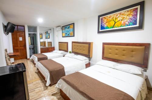 Postel nebo postele na pokoji v ubytování D´Milez Hotel