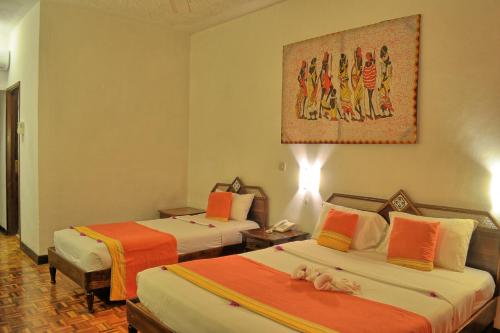 Katil atau katil-katil dalam bilik di Kaskazi Beach Resort