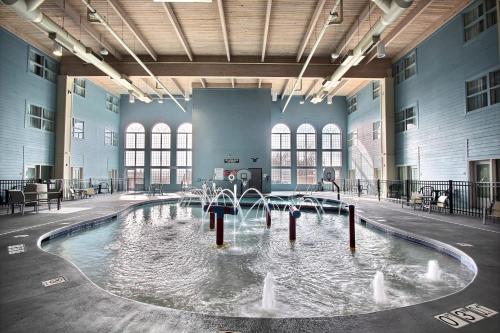 a pool of water with fountains in a building at Holiday Inn Express Hotel & Suites Milwaukee Airport by IHG in Milwaukee