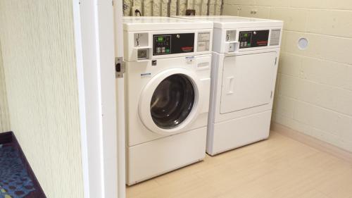 a washing machine and a dryer in a room at Holiday Inn Express Pittsburgh West - Greentree by IHG in Pittsburgh
