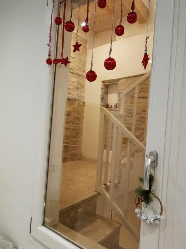a door with christmas ornaments hanging from it at Affittacamere Badia in Foligno