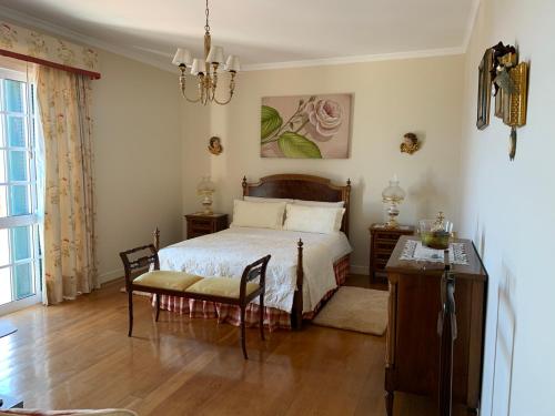 Posteľ alebo postele v izbe v ubytovaní Vila Tagus Garajau