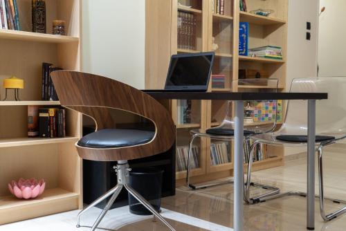 a desk with a laptop computer on top of it at Volos Center Luxury Home in Volos