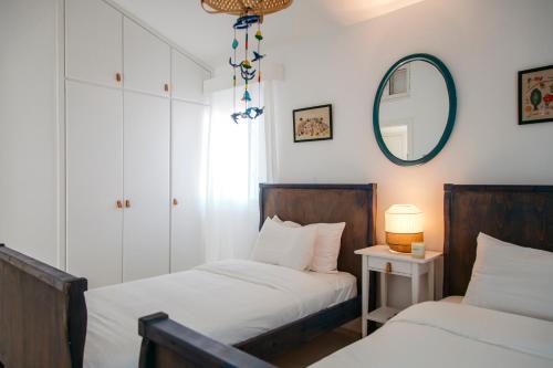 Ένα ή περισσότερα κρεβάτια σε δωμάτιο στο Island Home Seaside Villa