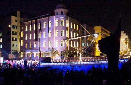 a large building with blue lights in front of it at Volos Center Luxury Home in Volos