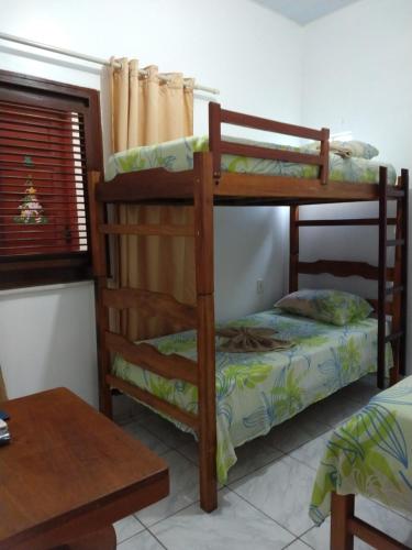 a bedroom with two bunk beds in a room at Pousada Jatobá in Barreirinhas
