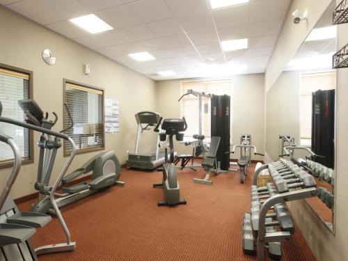 a fitness room with treadmills and cardio machines at Stonebridge Hotel Dawson Creek in Dawson Creek