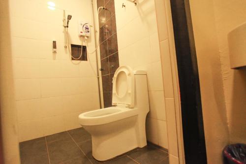 a bathroom with a toilet in a stall at HOTEL PREMIUM in Ipoh