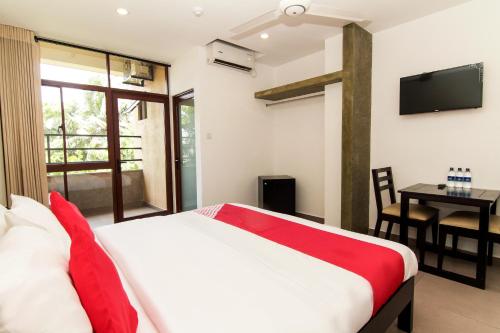 Postelja oz. postelje v sobi nastanitve Saninro Hotel - Ragama