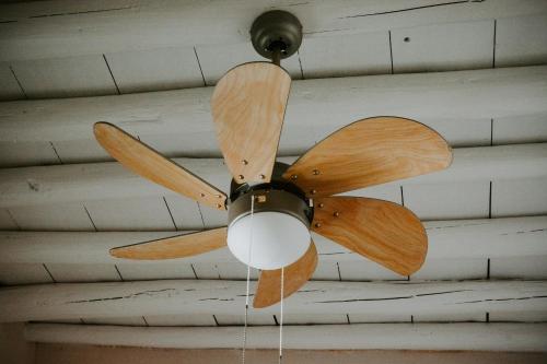 a ceiling fan hanging from a ceiling at The Veranda of Gavrion-Exclusive, Centrally located with Seaview in Gavrion