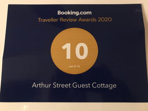 a book with the annual taylor street guest conference at Arthur Street Guest Cottage No16 in Hillsborough