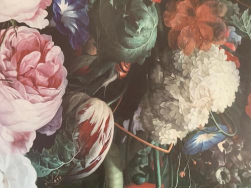 a painting of flowers on a wall at landpension-dette in Berlingerode
