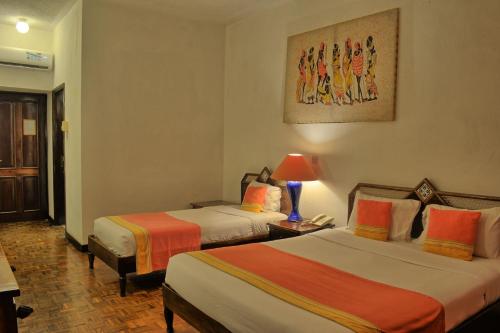 Katil atau katil-katil dalam bilik di Kaskazi Beach Resort