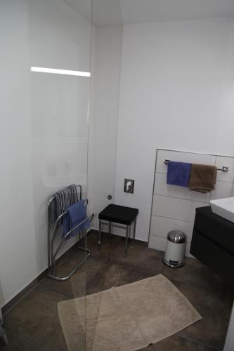 a room with a desk and a chair and a table at Appartementhaus Sabine in Kötschach