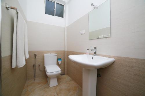 Koupelna v ubytování OYO 278 Hotel Rivelka